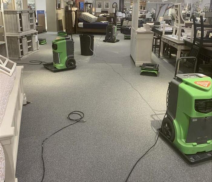 SERVPRO equipment working to dry a large commercial water loss